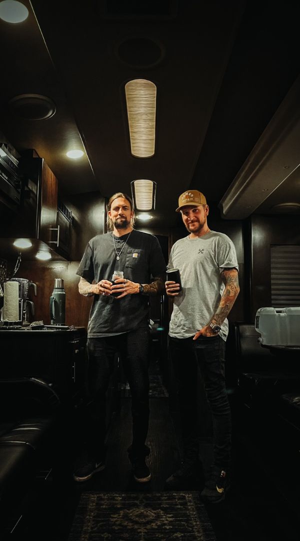 David Kennedy and Peter McKinnon standing in a Tour Bus